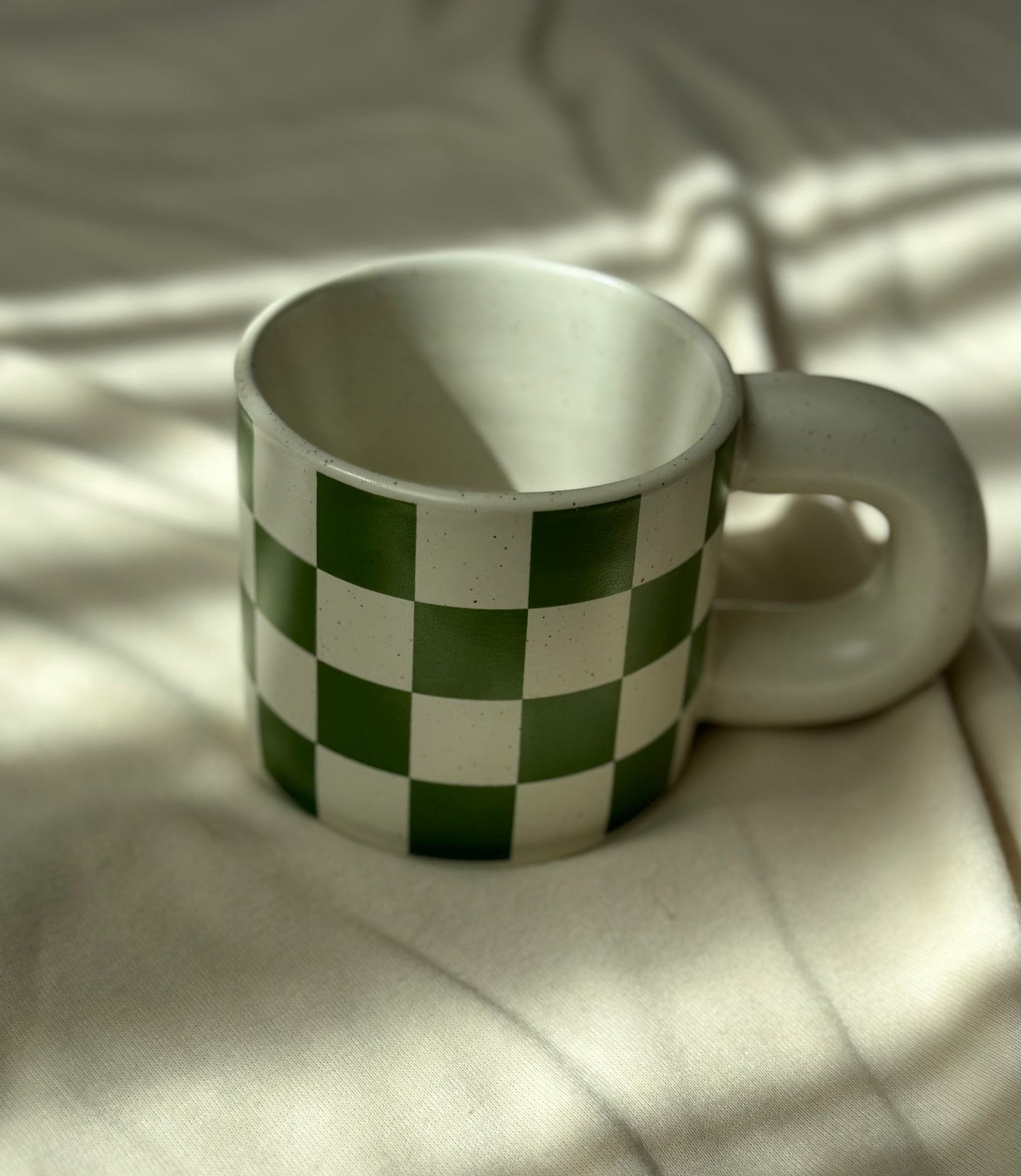 checkered ceramic cup